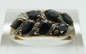 A 9ct gold ring set with sapphires and diamonds, size P, 2.