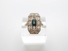 An 18ct Art Deco ring set with an emerald cut tourmaline and rose cut diamonds in a rectangular