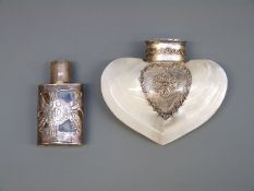 A mother of pearl scent bottle with white metal mounts and a white metal scent bottle with piecrced