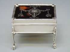 An Edwardian hallmarked silver and tortoiseshell miniature trinket box raised on cabriole legs with