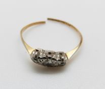 An 18ct gold ring set with three diamonds