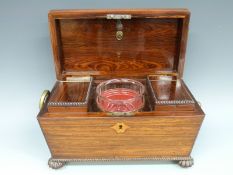 A 19thC rosewood tea caddy having cut glass mixing bowl flanked by two lidded compartments,
