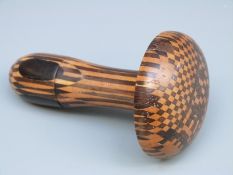 A Tunbridge Ware darning/sewing mushroom with slide off handle revealing a needle case and with