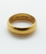 A 22ct gold wedding band, 10.