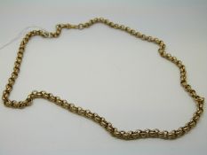 A yellow metal fob chain made up of circular links,
