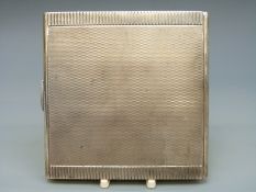 A white metal Art Deco style cigarette case marked sterling 925 JF, width 9cm,