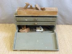 A vintage tool chest and contents including brass inlaid square, planes etc,