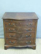A serpentine fronted chest of four graduated drawers,