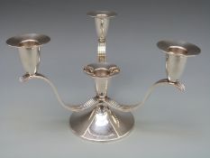 An A E Jones Victorian hallmarked silver Arts & Crafts candelabra with reeded supports,
