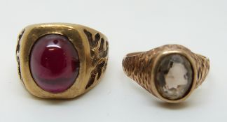 A 9ct gold ring set with a ruby cabochon (size N) and a 9ct gold ring set with a smoky quartz (size