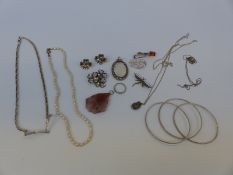 Three silver bangles, a silver necklace with Greek key design, agate pendant,