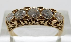 An 18ct gold ring set with five graduated diamonds, the largest approximately 0.