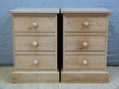 A pair of pine three drawer bedside cabinets,