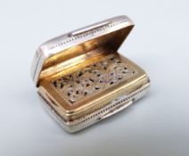 A Georgian hallmarked silver vinaigrette with gilt interior and hinged pierced cover,