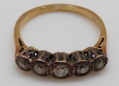 An 18ct white gold ring set with five diamonds,