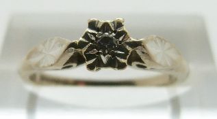 An 18ct white gold ring set with a diamond, size K, 2.