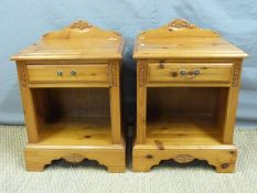 A pair of pine bedside cabinets,