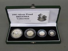 A cased 1997 Britannia silver proof set with certificate, comprising four coins,