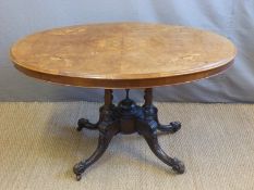 A Victorian inlaid walnut oval breakfast table,
