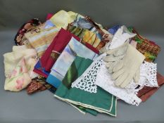 A collection of ladies scarves including silk examples together with other textiles including