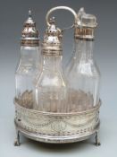 A George III hallmarked silver five bottle cruet with pierced decoration mahogany base raised on