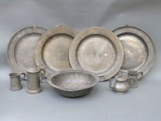 Four 18th / 19thC pewter chargers one with touch marks, diameter 38cm,