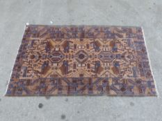 A small Afghan rug with tree of life style animal decoration,