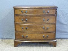 A small bow fronted graduated chest of four drawers,