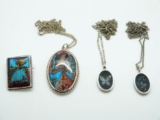 A silver pendant & brooch set with butterfly wing and two opal mosaic silver pendants & chains