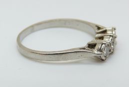 An 18ct white gold ring set with three diamonds totalling approximately 0.