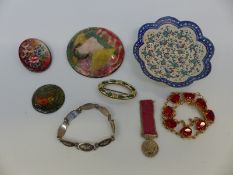 A collection of enamel items including Persian dish, English plaques, Russian enamel brooch,