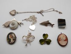 A silver brooch set with a shell in the form of a snail, a banded agate miniature book,
