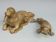 A 19thC bronze walrus inkwell with hinged head,