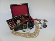 A collection of jewellery including carved coral, Miracle and silver pendants, Alpaca,