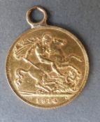 A 1914 gold half sovereign with mount
