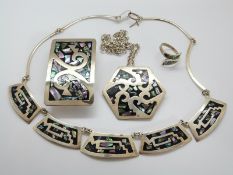 A silver necklace set with mosaic abalone, with matching ring,