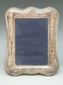 A modern hallmarked silver mounted photograph frame to suit 7 x 5 inch photograph,
