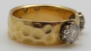 An 18ct gold ring set with two diamonds each approximately 0.6ct, size O, 8.