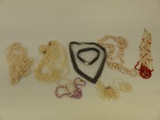 A quantity of pearls including black pearl bracelet and necklace,