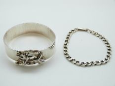 A white metal bangle in a bespoke design,