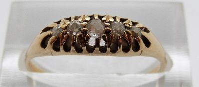 An 18ct gold ring set with five graduated diamonds, size P, 2.