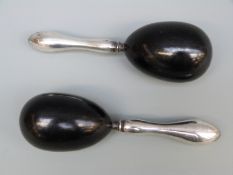A pair of hallmarked silver and ebony darning/sewing eggs, Birmingham 1934 maker Chrisford & Norris,