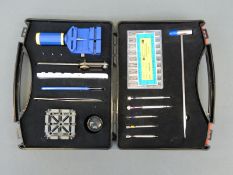 A watch repair tool kit in hard carry case.