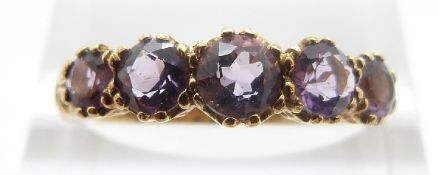 A 9ct gold ring set with five amethysts, size O, 2.