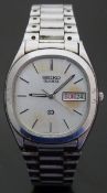 Seiko SQ gentleman's wristwatch with day and date aperture, luminous hands, two-tone baton markers,