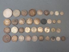 A collection of largely pre 1920 silver coinage including overseas, 19thC French, Austrian etc.