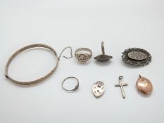 A silver bangle, Victorian silver brooch with engraved detail (Birmingham 1891),