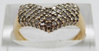 An 18ct gold ring set with diamonds in a V shape, size P, 3.