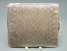 A George V hallmarked silver engine turned cigarette case, Birmingham 1934,