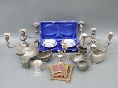 A collection of silver plate to include a pair of candelabra, pewter tea pot,